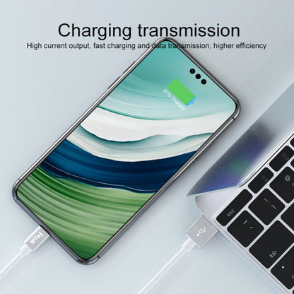 White USB cable plugged into a smartphone for charging and data transfer