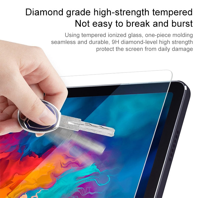 Lenovo tablet tempered glass screen protector with hand pressing tool near edge