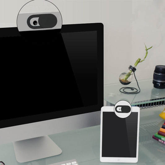 Camera privacy cover with sliding black shutter shown on a white card