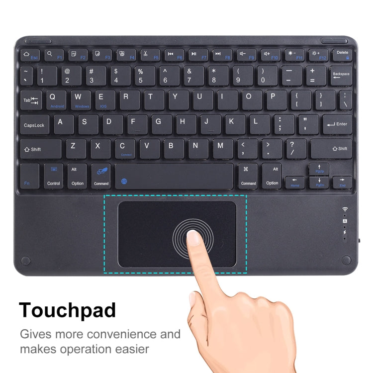 Portable Bluetooth keyboard touchpad area with a finger pointing at the trackpad