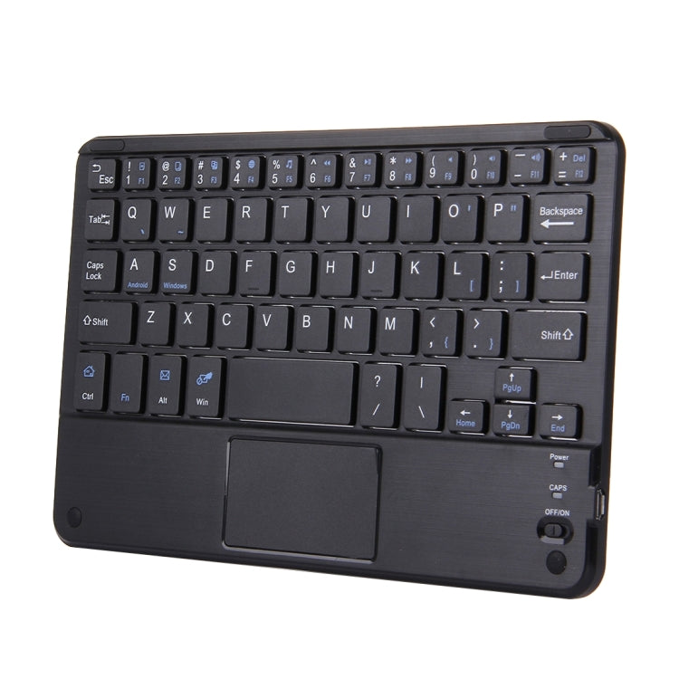 Black Bluetooth keyboard with touch panel, angled view of keycaps and track area