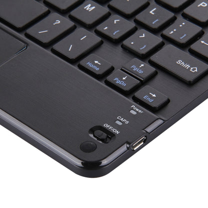 Black Bluetooth keyboard corner with charging port and power controls near touch panel