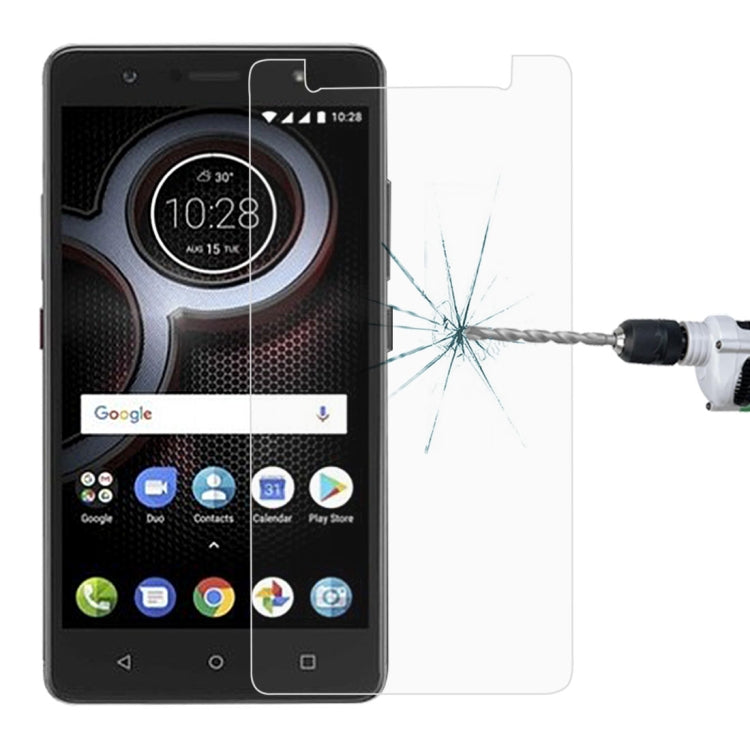 Tempered glass screen protector applied to Lenovo K8 phone screen, impact point visible