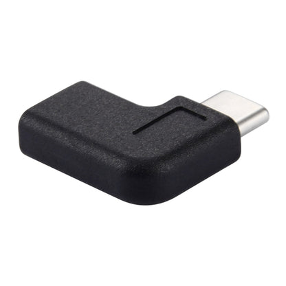 Black 90-degree USB-C adapter with grip notch, angled connector