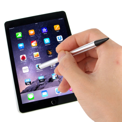 Silver capacitive stylus pen with pointed tip being used on a tablet screen