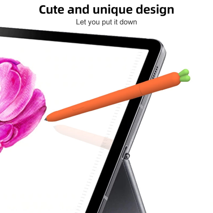 Orange carrot-shaped stylus resting on tablet screen edge