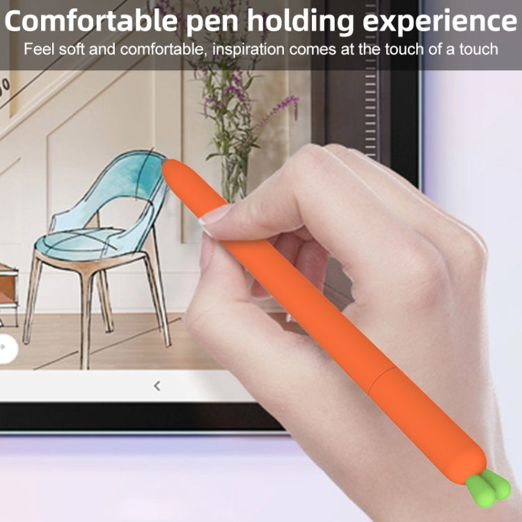 Hand holding orange carrot-shaped silicone stylus with green end