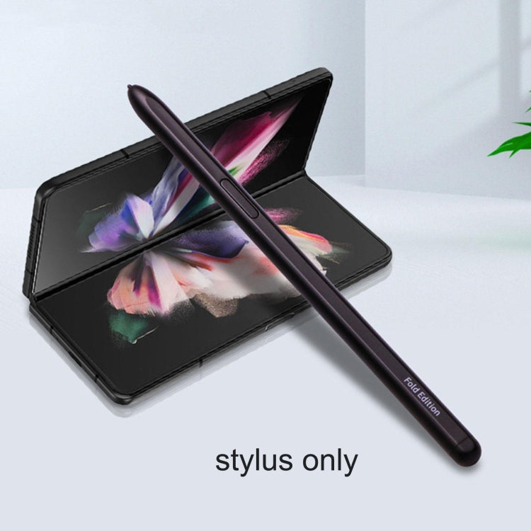 Black stylus pen diagonally across tablet screens, stylus-only angle shown.