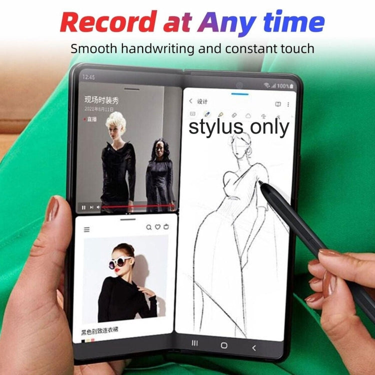 Black stylus pen in hand drawing on foldable phone screen.
