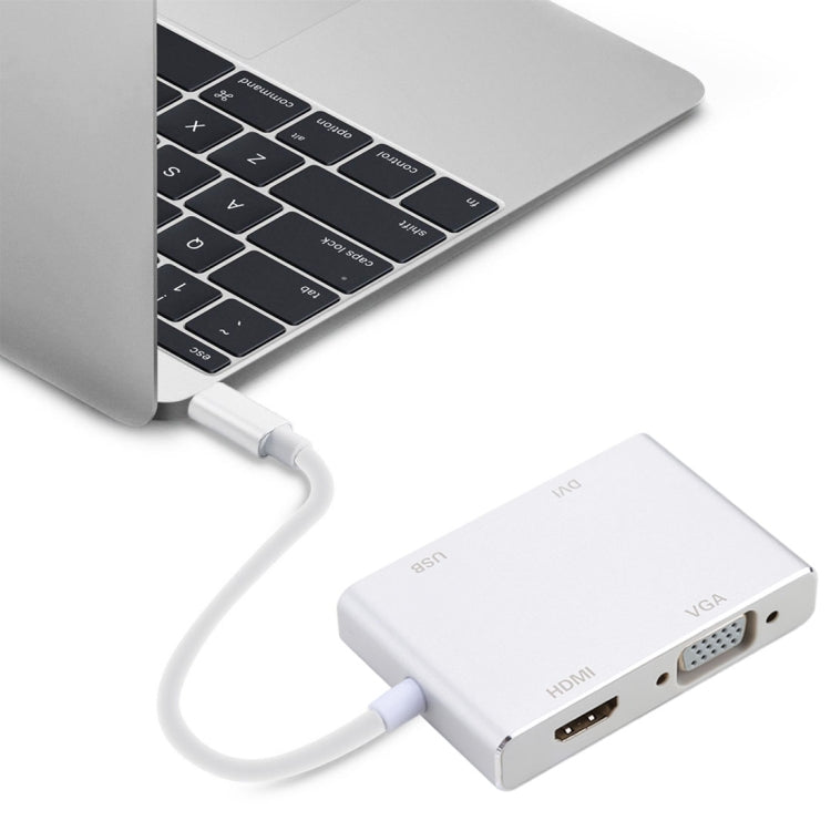 Gray USB-C display adapter connected to laptop with VGA and HDMI ports