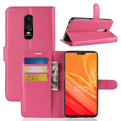 Pink litchi-texture flip leather phone case with card slots and wallet holder