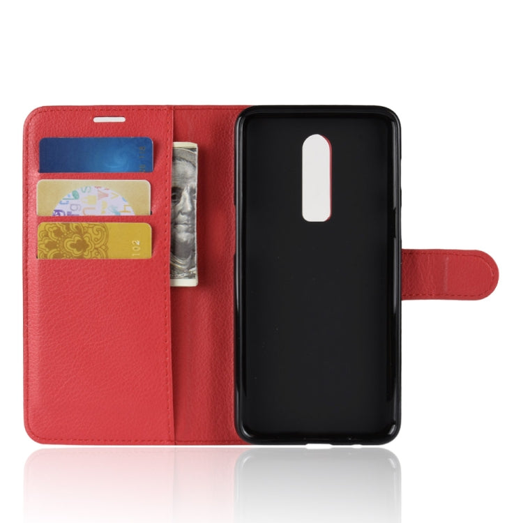 Red leather flip phone case with card slots, open front, and protective back