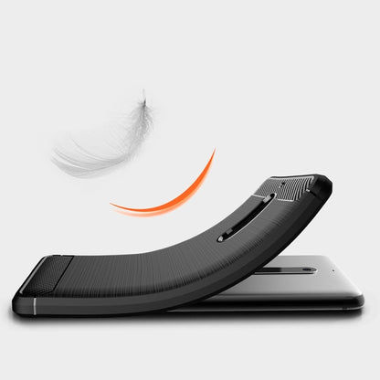Shockproof TPU phone case with dark carbon-fiber texture, raised bezel for screen protection