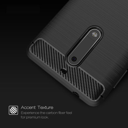 Nokia 5 TPU phone case close-up: brushed metal look with carbon-fiber patterned camera area