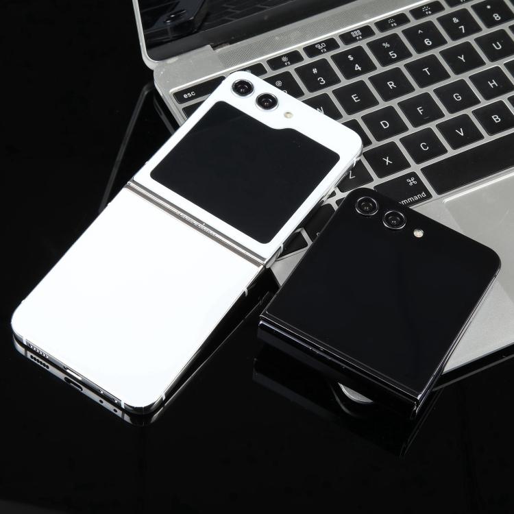 White and black folding phone dummy display models on a desk, blank screens visible