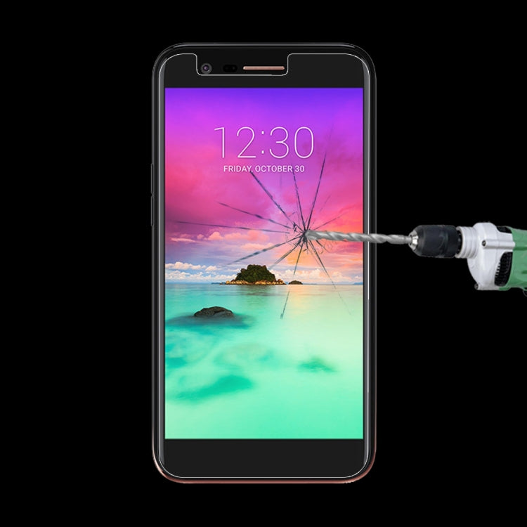 Tempered glass screen protector on a smartphone screen with impact crack