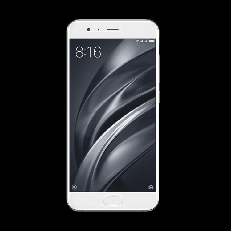 Smartphone with tempered glass screen protector fitted, showing clear display over dark wallpaper