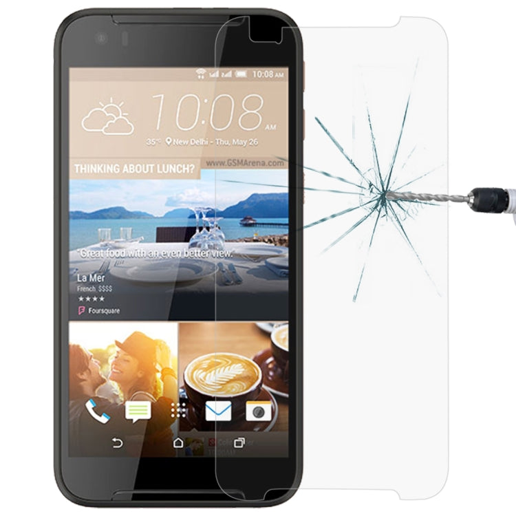 Tempered glass screen protector on a smartphone front, with shattered glass impact