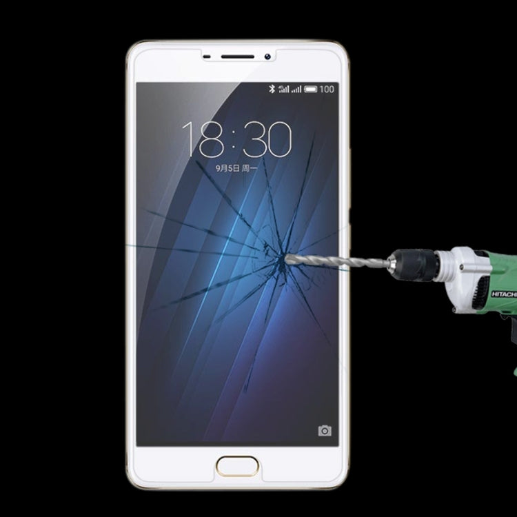 Tempered glass screen protector on a smartphone display with impact cracks visible