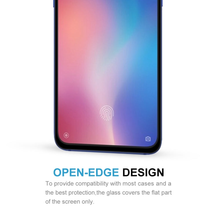 Tempered glass screen protector close-up on smartphone front; fingerprint sensor cutout visible
