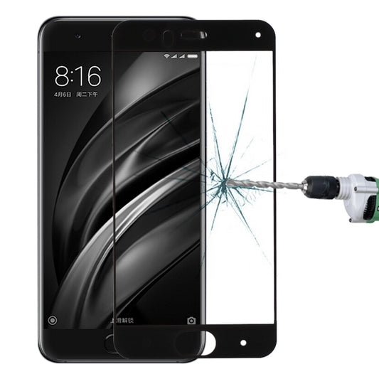 Tempered glass screen protector for smartphone, full-screen fit aligned on black phone