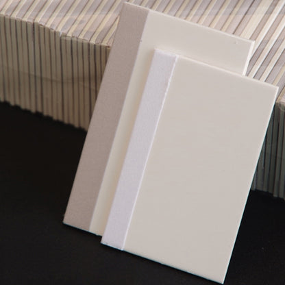 Set of white TPU scratch cards stacked and angled