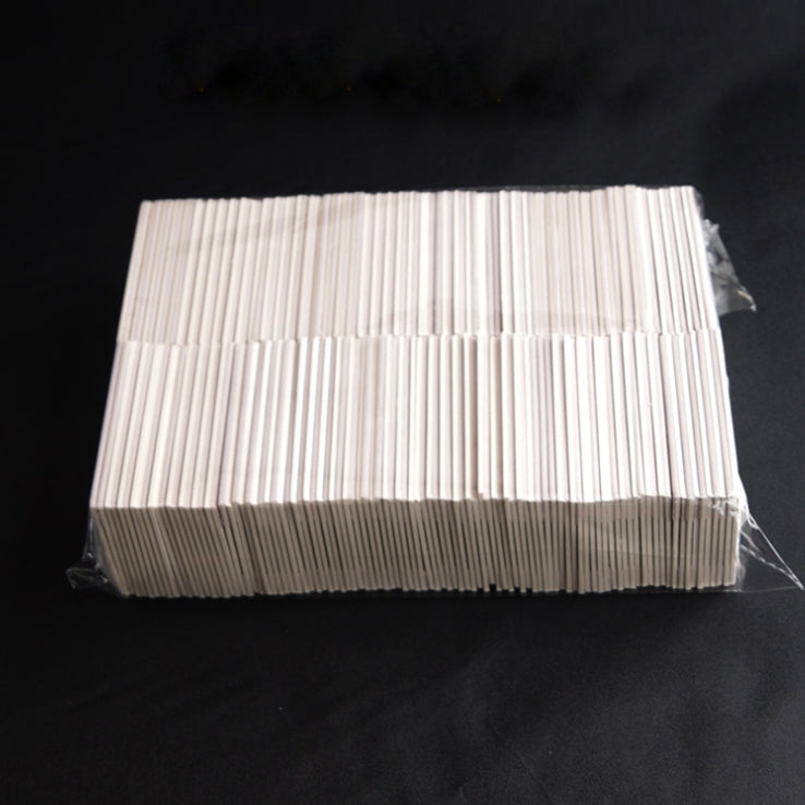 Pack of white TPU scratch cards bundled in a clear plastic wrapper