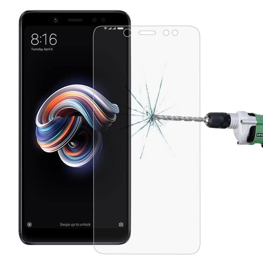 Tempered glass screen protector film with curved edges for a smartphone display