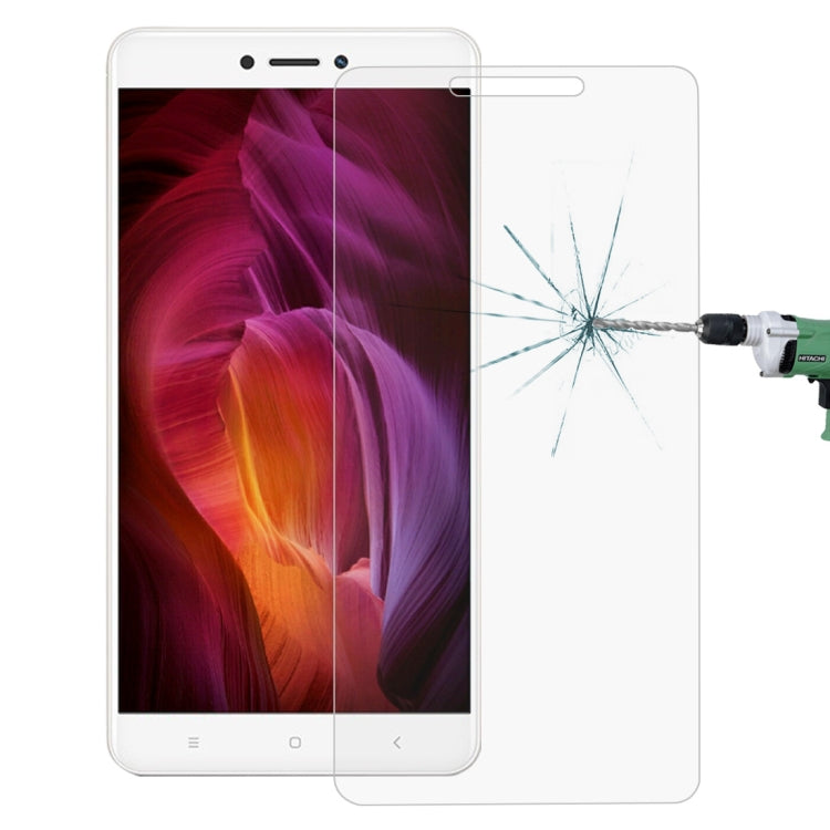 Tempered glass screen protector on phone with impact crack test on film surface