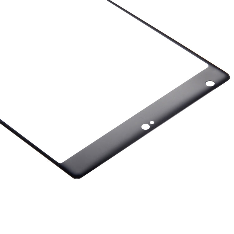 Close-up of tempered glass screen protector edge with black bezel and cutouts