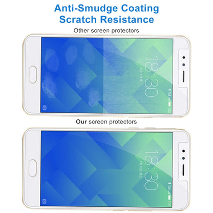 Anti-smudge tempered glass screen protector film showing scratch resistance effect