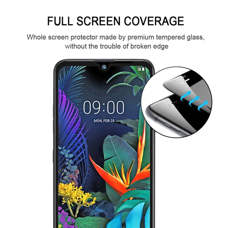 Tempered glass screen protector covering smartphone display, rounded corner cutouts