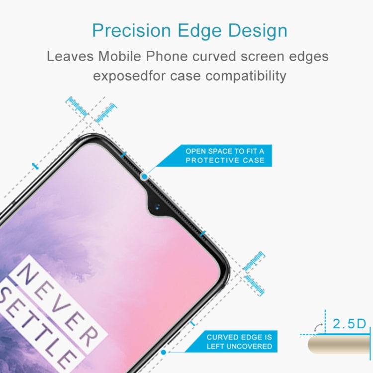 Tempered glass protector with 2.5D curved edges for case compatibility on OnePlus 7T.