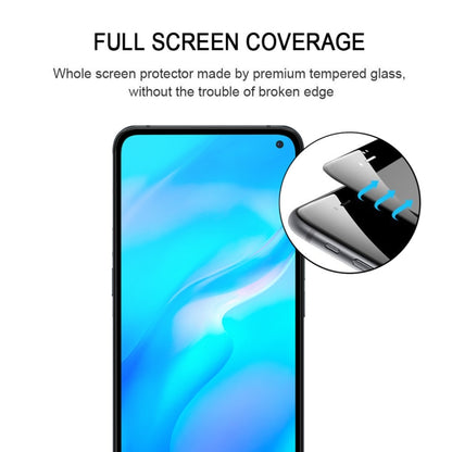 Full-screen tempered glass protector aligned over smartphone display