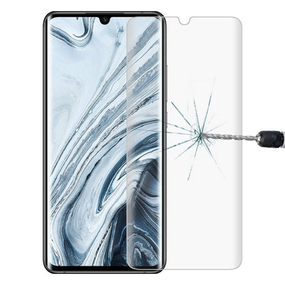Tempered glass screen protector on phone screen showing impact crack protection