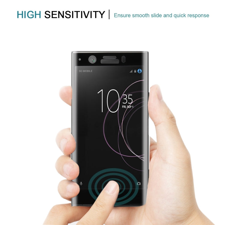 Black tempered glass screen protector held on a phone, smooth full-screen coverage