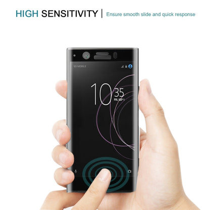 Black tempered glass screen protector held on a phone, smooth full-screen coverage