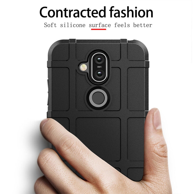 Black rugged silicone phone case for Nokia 8.1 / X7 held in hand