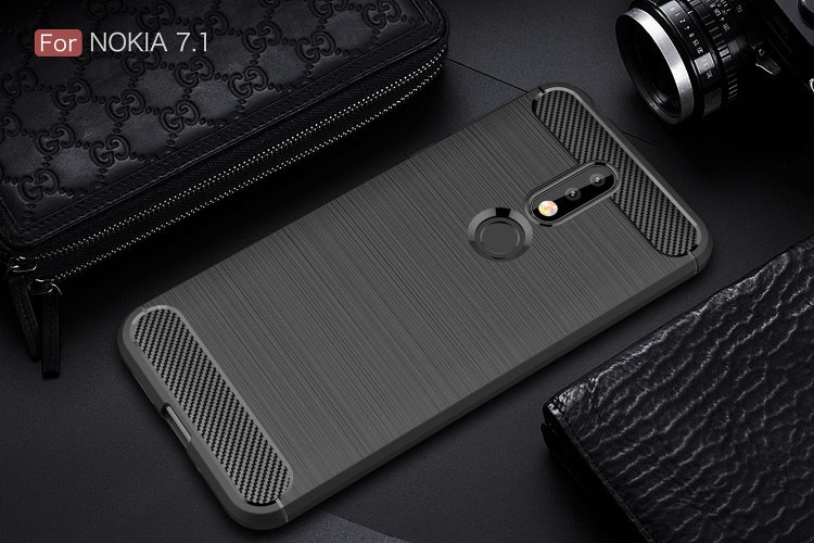 Brushed carbon fiber TPU phone case back in dark color, textured grip and camera openings