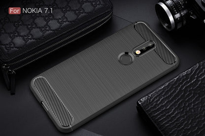 Brushed carbon fiber TPU phone case back in dark color, textured grip and camera openings
