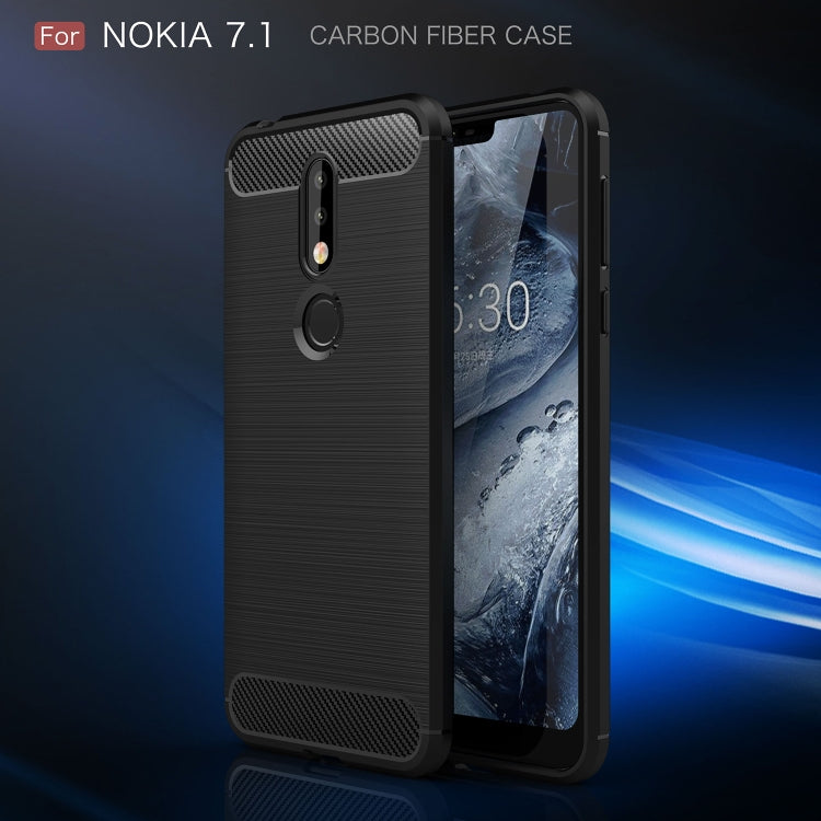 Brushed carbon fiber TPU phone case in dark blue, angled view with camera and ring cutout