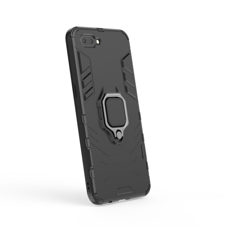 Black OPPO A5 TPU case with raised shield design and magnetic ring holder