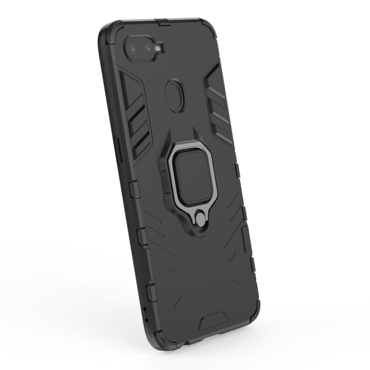 Black shockproof phone case with raised camera cutout and magnetic ring holder