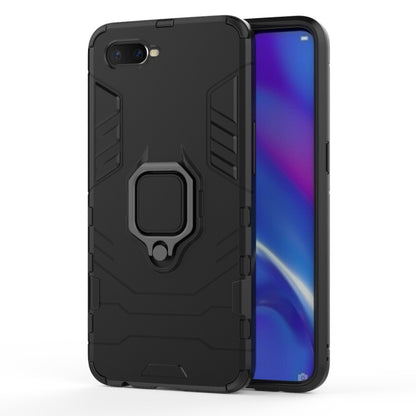 Black protective phone case with magnetic ring holder on the back