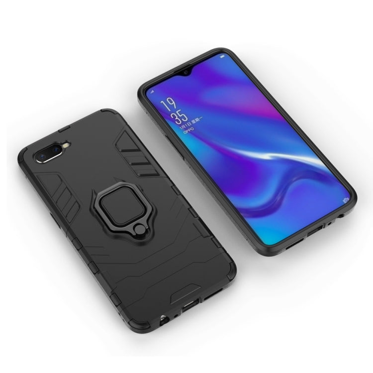 Black rugged phone case with magnetic ring holder and camera cutout