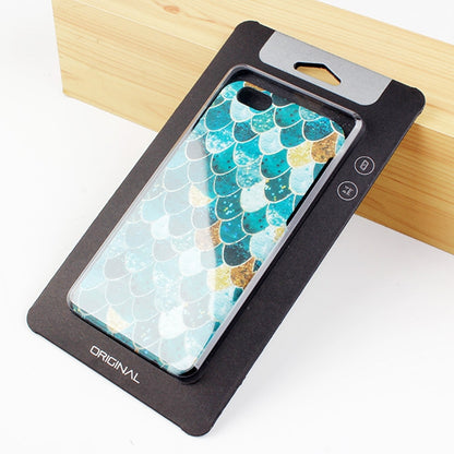 Phone case package box with black kraft backing and cutout window, turquoise scale pattern