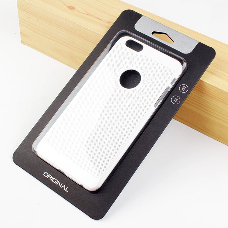 White phone case with black camera cutout on black backing card, angled view