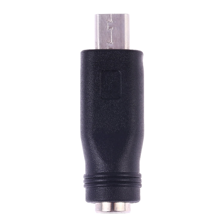 Micro USB male plug on a black DC 5.5mm barrel female power converter