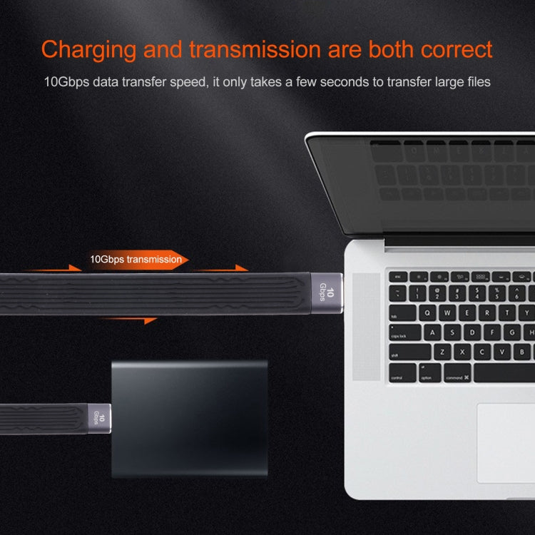 Flat USB-C data and charging cable with Type-C connector plugged into laptop