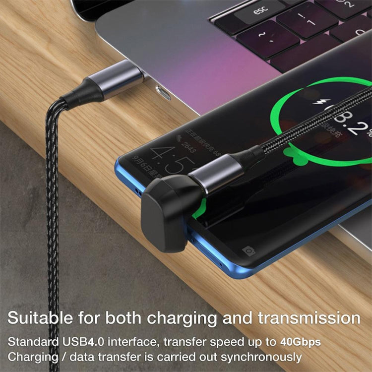 Black USB-C adapter connected between laptop and phone ports, gold contacts visible